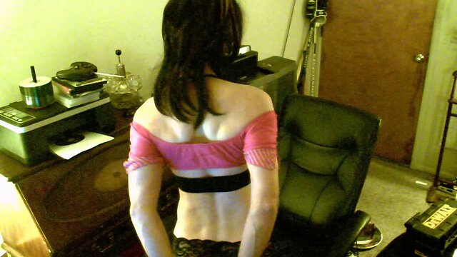 Lecherous crossdresser plays with a dildo at home