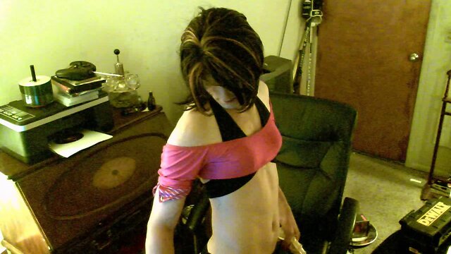 Lecherous crossdresser plays with a dildo at home