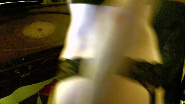 Lecherous crossdresser plays with a dildo at home