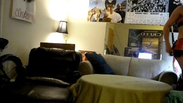 Nasty crossdresser in latex dildoing himself