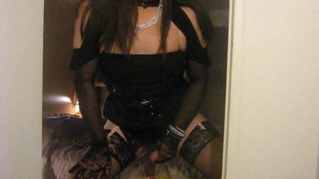 Slutty tranny in black strokes and fucks herself