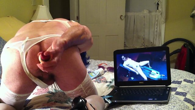 Nasty crossdresser dildoing himself furiously