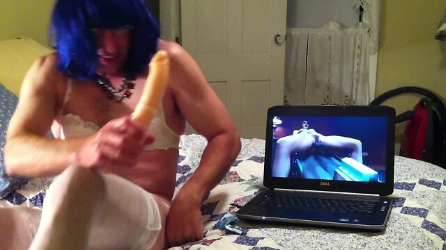 Nasty crossdresser dildoing himself furiously