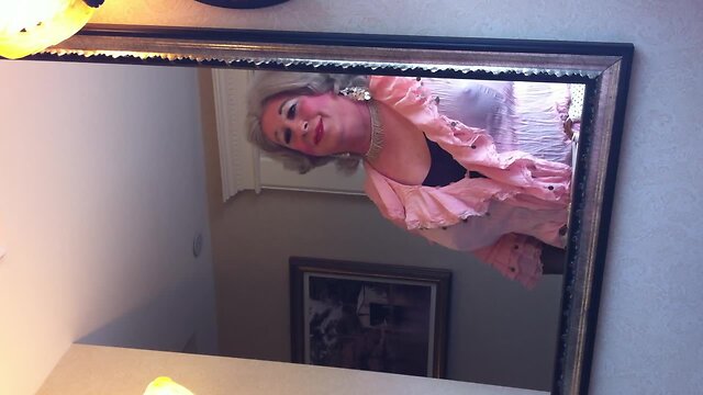 Crossdresser in front of the mirror