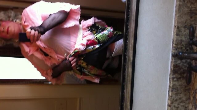 Crossdresser in front of the mirror