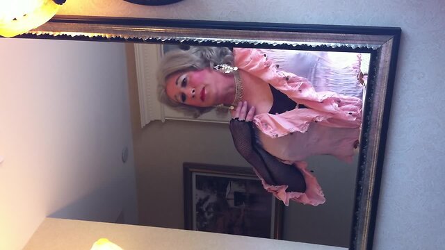 Crossdresser in front of the mirror