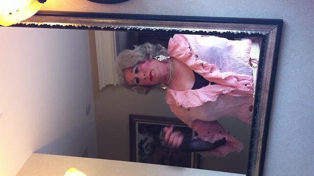 Crossdresser in front of the mirror