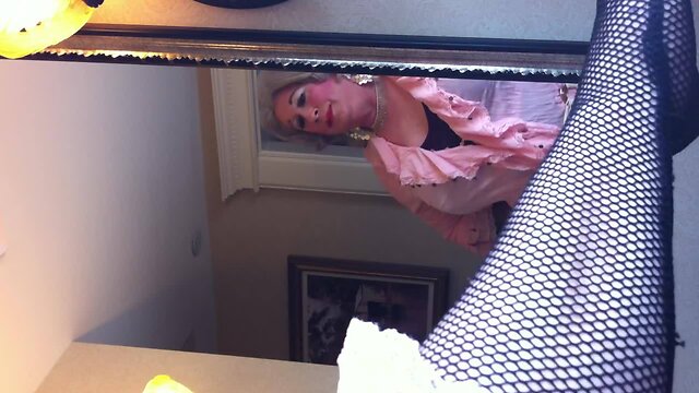 Crossdresser in front of the mirror