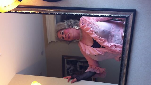Crossdresser in front of the mirror