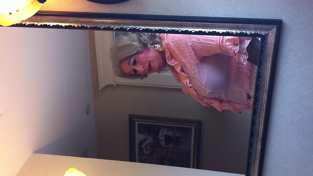 Crossdresser in front of the mirror